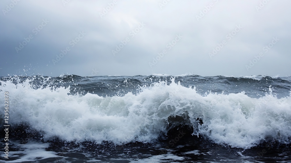 Poster dynamic ocean waves crashing against dark rocky shore under overcast sky : generative ai