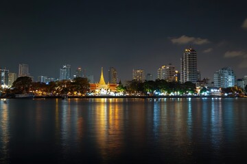 Obraz premium Bangkok Riverfront Pagoda Night Reflection