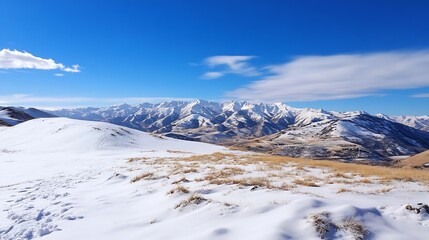 Obraz premium Breathtaking Snowy Mountain Landscape Under Clear Blue Sky with Rolling Hills : Generative AI