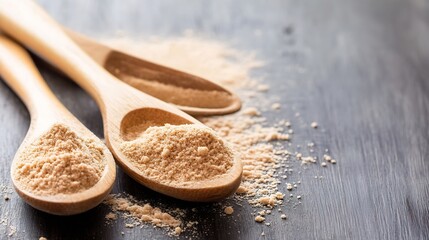 Natural ground ginger powder displayed on wooden spoons for cooking and baking : Generative AI