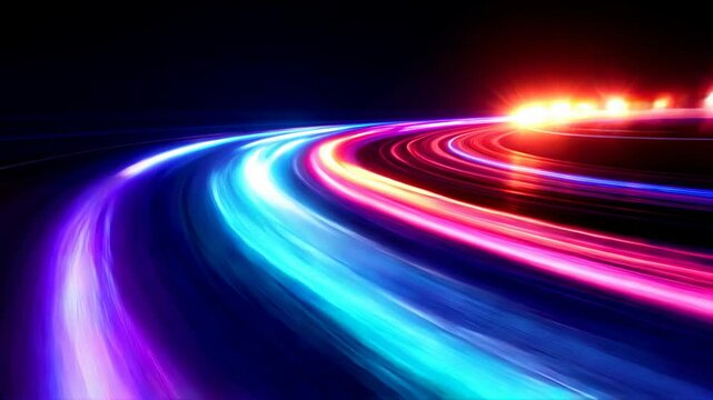 Vibrant neon light trails along a curved highway at night