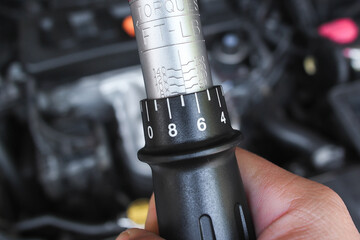 Close up of scale torque adjuster of torque wrench , Mechanic tools concept