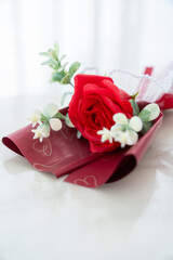 Valentine's day concept, bouquet of red and pink roses Put on the table food lunch In a restaurant background