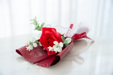 Valentine's day concept, bouquet of red and pink roses Put on the table food lunch In a restaurant background