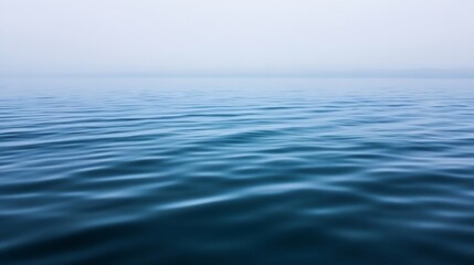 Naklejka premium Smooth and serene water surface with gentle waves reflecting a soft overcast sky : Generative AI