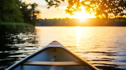 Fototapeta premium Serene View of a Canoe at Sunset on a Calm Reflective Lake Surrounded by Nature : Generative AI