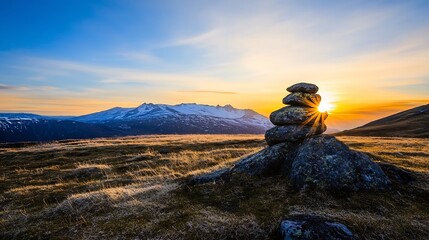 Naklejka premium Stunning sunset view with layered mountains and a stone stack symbolizing tranquility in nature : Generative AI