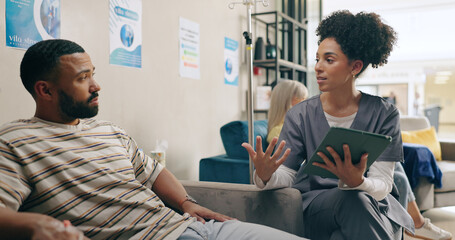 Healthcare, tablet and man consulting doctor in hospital for online, planning or surgery schedule...