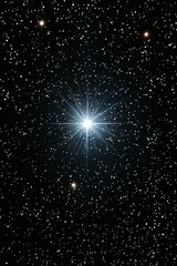 A bright star in the night sky with stars in the background