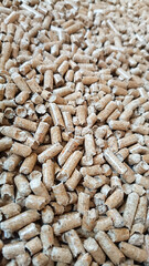 Wood pellet background. Close up natural wood pellet. Ecological heating, renewable energies Biofuels. Top view. Flat ecological fuel for solid fuel boilers.