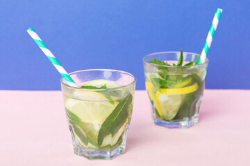 Mojito summer refreshing cocktail with ice and mint. mojito cocktail with lime, lemon and mint in a tall glass with a stick
