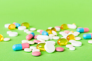 Many different colorful medication and pills perspective view. Set of many pills on colored...
