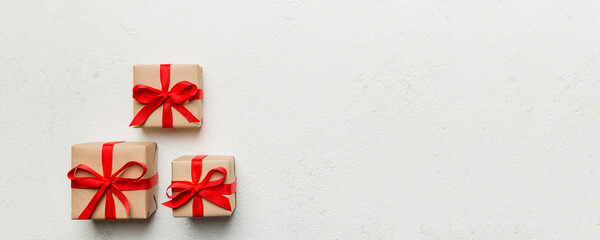 Valentine day composition: red gift box with bow and heart. Christmas present. View from above....