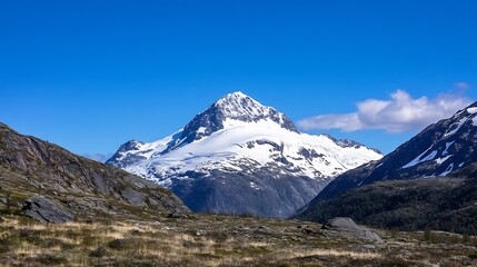 Fototapeta premium Scenic Mountain Landscape with Snow-Capped Peaks Under Clear Blue Sky : Generative AI