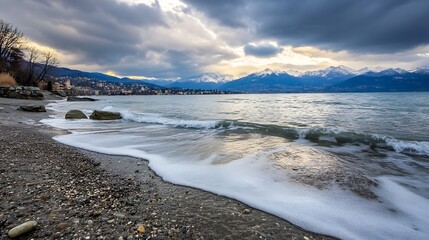 Obraz premium Serene Beach Landscape with Gentle Waves and Mountains in the Background Under Dramatic Clouds : Generative AI