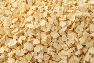 Dried Onion Flakes Close-Up Texture Background