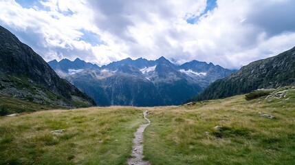 Obraz premium Breathtaking Mountain Landscape with Scenic Path Under a Cloudy Sky : Generative AI