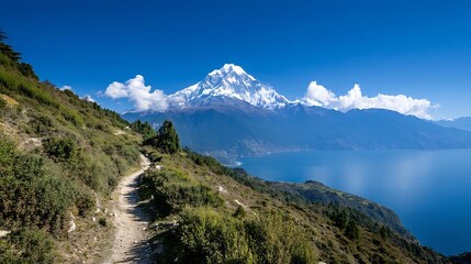 Breathtaking mountain view with snow capped peak surrounded by lush green hills and lake : Generative AI
