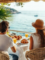 Morning Ritual: Captured a charming scene of a couple enjoying breakfast croissants with juice, sharing an idyllic moment together by the sea.