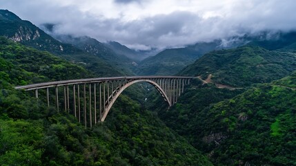 Majestic Bridge Across Lush Green Mountains Under Dramatic Cloudy Skies : Generative AI