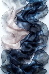 A close up of a blue and white scarf on a white surface