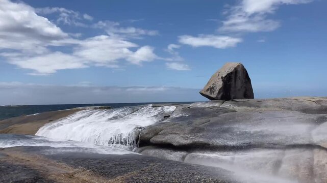 Bicheno blowhole at granite boulders on seashore of east coast Tasmania