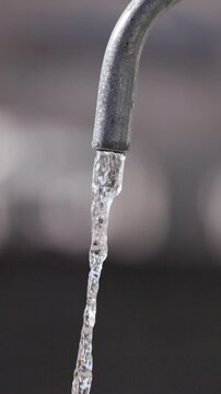 Slow Motion video of water flowing out of a nasone fountain in Rome - Italy