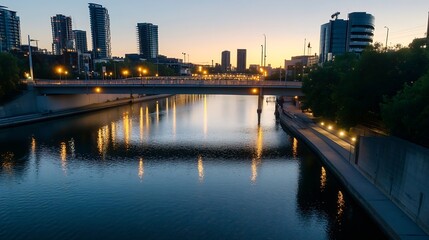 Obraz premium City skyline at sunset reflecting on river with illuminated bridge and modern buildings : Generative AI