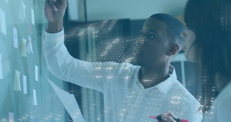 Image of financial data processing over diverse colleagues discussing work in office