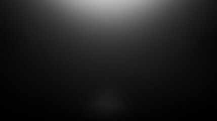 A black and white photo of a dark room with a light shining on it