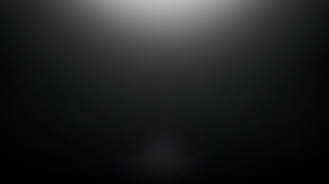 Fototapeta A black and white photo of a dark room with a light shining on it