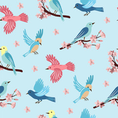 Spring birds and flowering branches on light blue background. Colorful cute seamless pattern for printing on wallpaper, wrapping paper, textile on other surfaces.