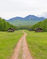 Winding path through rural landscape with rustic stone buildings, mountains in background