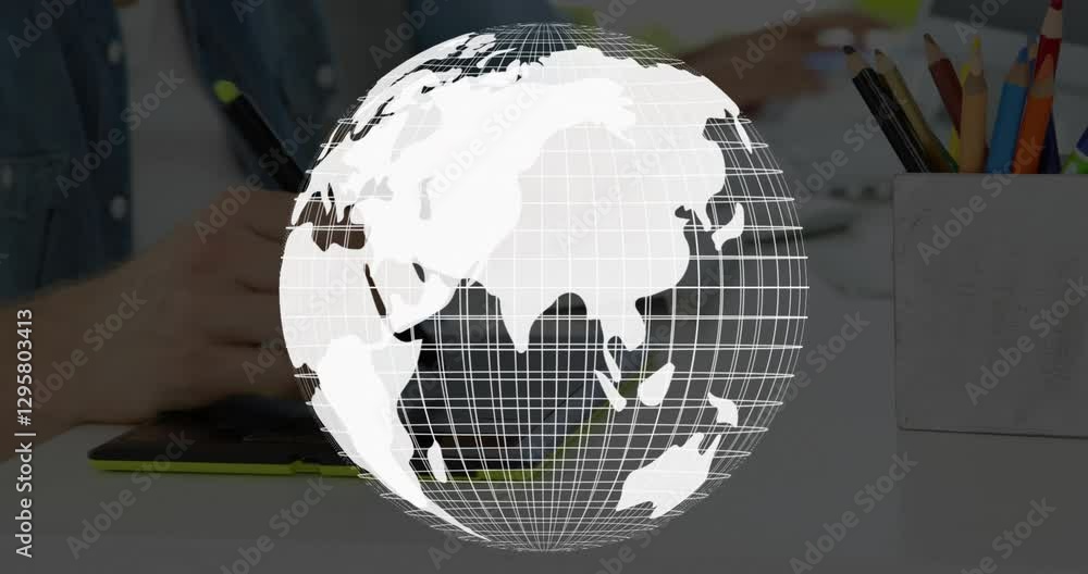 Poster rotating globe animation over person using tablet at desk with pencils