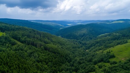 Obraz premium Stunning Aerial View of Lush Green Hills Under a Dramatic Sky with Rolling Clouds : Generative AI