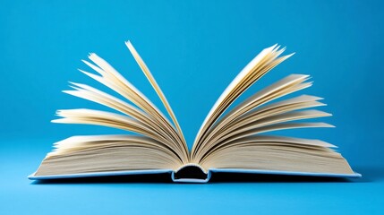 Aged Book with Fanned Pages on Blue Background