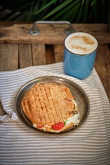 sandwich with cheese, tomato, turkey, lettuce. homemade bread. Wooden background	