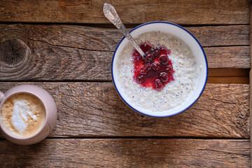 poppy seed rice pudding with cherry sauce.	