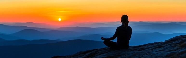 A lone figure sits cross-legged on a rocky outcrop, meditating as the sun rises over distant peaks. The vibrant colors of dawn illuminate the serene landscape, creating a peaceful ambiance