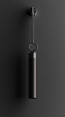 Minimalist Black Wall-Mounted Hanging Tube Fixture with Chain and Ring Against Dark Gray Background for Contemporary Interior Design