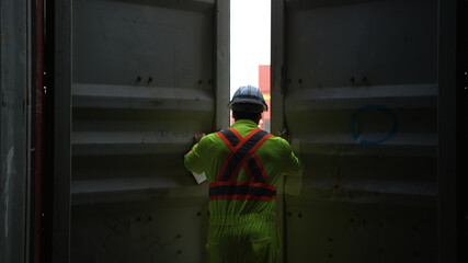 Engineers and technicians inspect the inside of containers