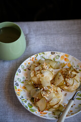 Syrniki with pear slices and nuts