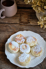 Syrniki on a white plate. 	
