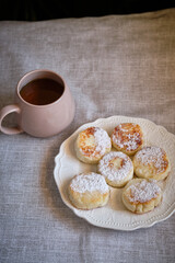 Syrniki on a white plate. 	
