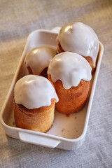 Rum baba. Side view, wooden background.