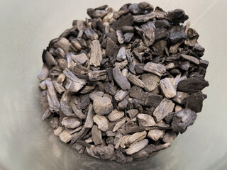 Close-up of biochar, produced through wood pyrolysis, a sustainable solution for carbon sequestration. Ideal for themes around CO2 reduction, climate change, and eco-friendly technology