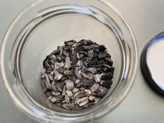 Close-up of biochar, produced through wood pyrolysis, a sustainable solution for carbon sequestration. Ideal for themes around CO2 reduction, climate change, and eco-friendly technology