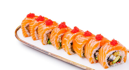 Delicious sushi rolls with fresh salmon and red caviar garnishing