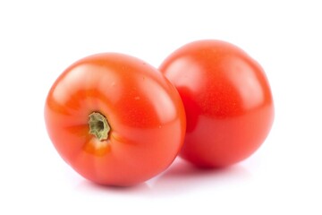 Two red tomatoes on white background round plump droplets
