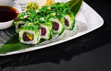 Fresh tuna sushi roll with seaweed salad